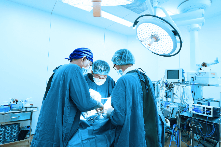 medical team in operating room performing surgery